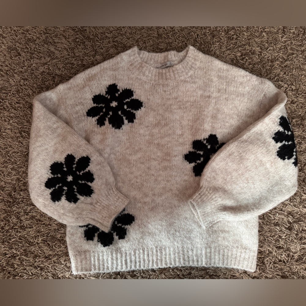 See and Be Seen Boutique brand. Cozy Beige Sweater with Black Floral Design.